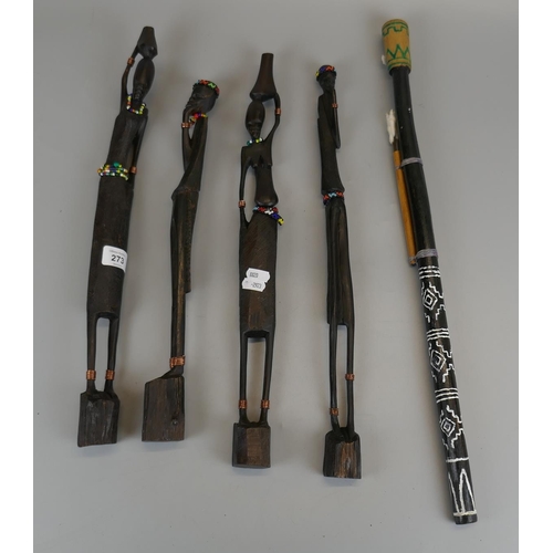 273 - Set of 4 tribal figures together with a blow pipe and darts