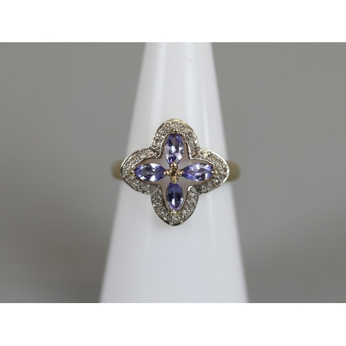 31 - Gold tanzanite and diamond ring - Size K