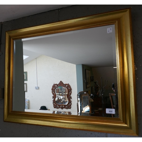 486 - Gilt framed bevelled glass mirror approx size 75cm x 60cm