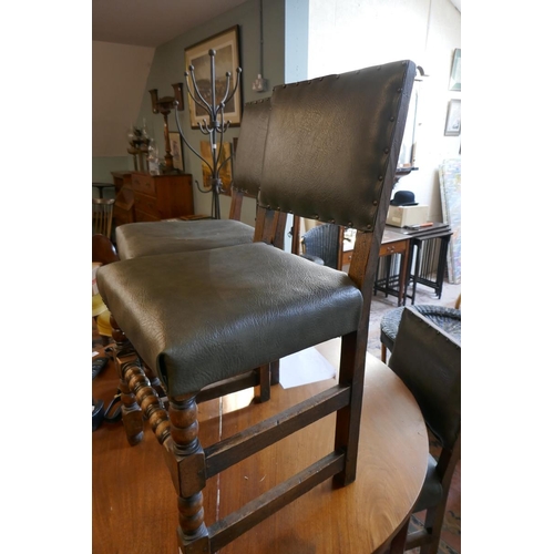 489 - Set of four oak chairs with leather upholstery