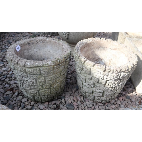 556 - Pair of round stone planters