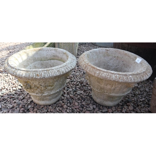 558 - Pair of round stone planters