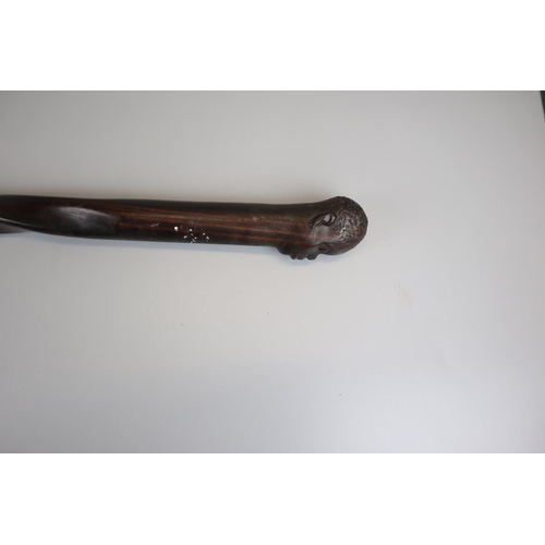 85 - Ebonised carved walking cane