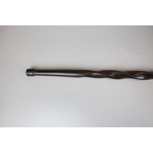 85 - Ebonised carved walking cane