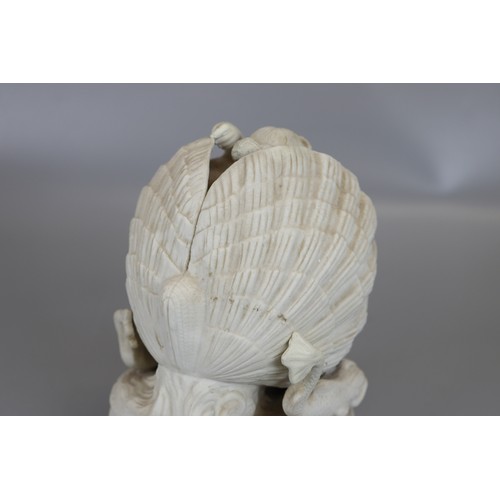 105 - Parian ware figure of lady in shell - Approx H: 21cm