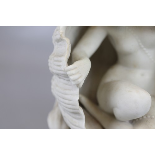 105 - Parian ware figure of lady in shell - Approx H: 21cm