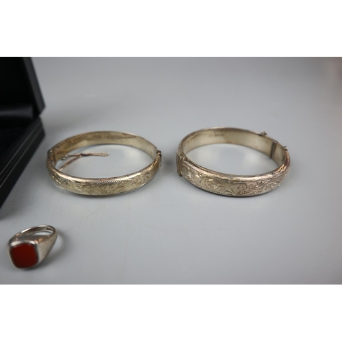 10 - Collection of silver jewellery to include 2 bangles, 2 lockets and a ring