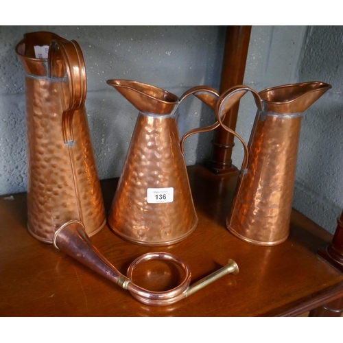 136 - 3 hand beaten copper jugs together with hunting horn