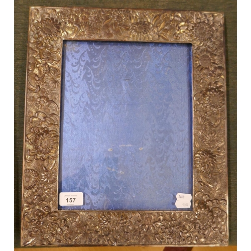 157 - Early 20th.C large Japanese white metal photo frame with repose decoration of flowers with blue silk... 