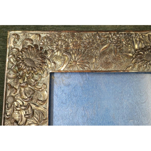 157 - Early 20th.C large Japanese white metal photo frame with repose decoration of flowers with blue silk... 