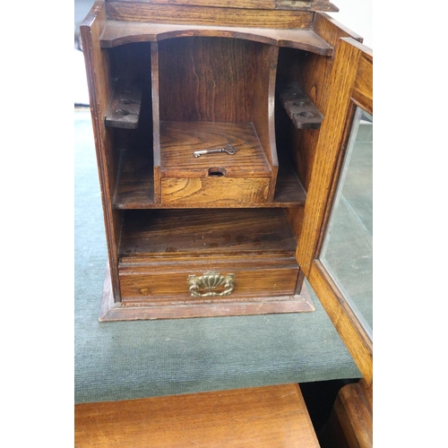 169 - Antique oak pipe cabinet with key