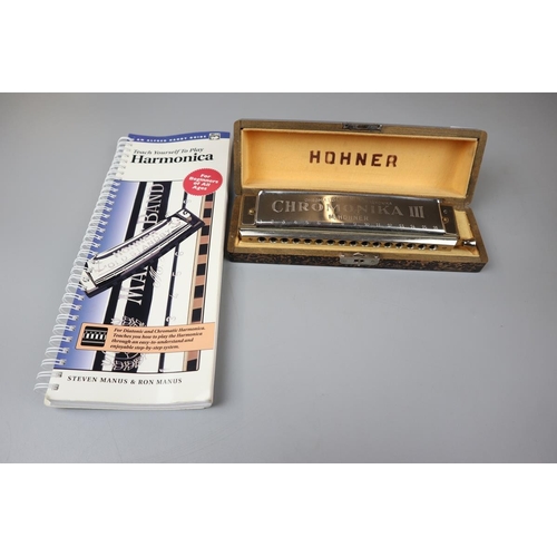 179 - Hohner harmonica together with a teach your self to play book