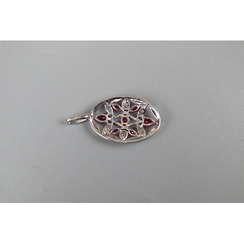 21 - White gold ruby & diamond pendant