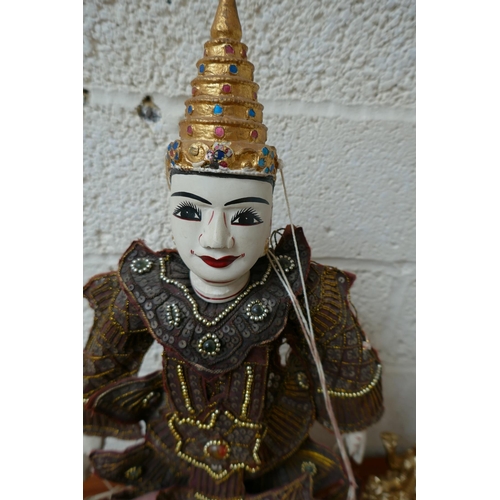 297 - Oriental puppet on stand - Approx. height: 51cm together with 2 gilt Ganesh figures