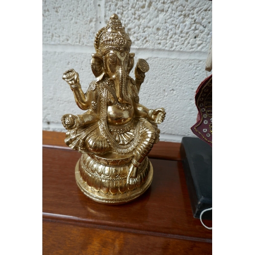 297 - Oriental puppet on stand - Approx. height: 51cm together with 2 gilt Ganesh figures