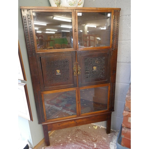 303 - Oriental themed corner cabinet with well carved panels