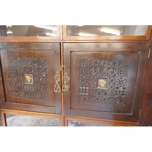 303 - Oriental themed corner cabinet with well carved panels