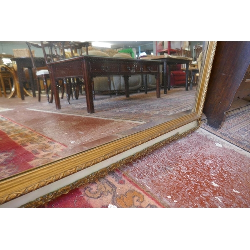 308 - Gilt framed bevelled glass mirror