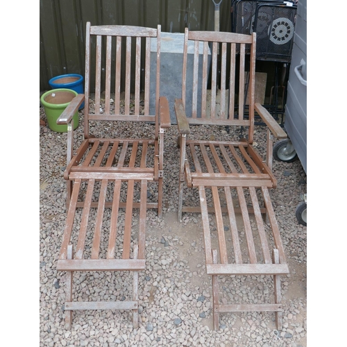 336 - Pair of teak steamer chairs with cushions