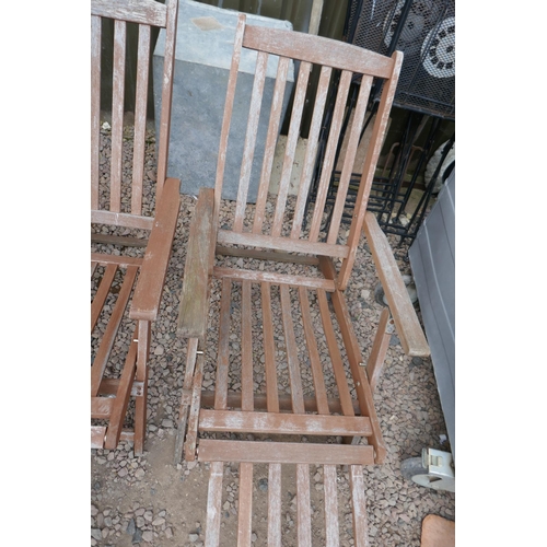 336 - Pair of teak steamer chairs with cushions