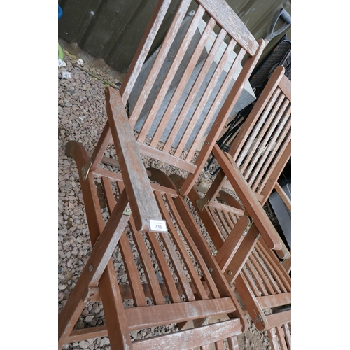 336 - Pair of teak steamer chairs with cushions