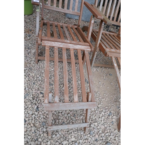 336 - Pair of teak steamer chairs with cushions