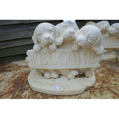 345 - 3 stone welcome dog statues