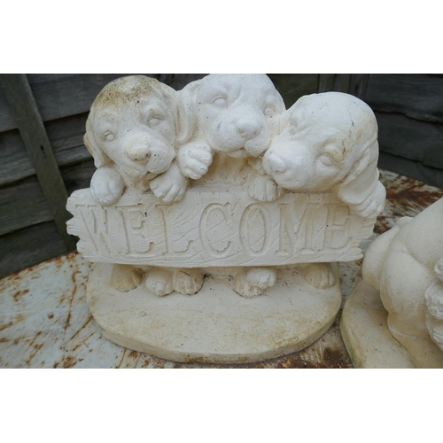 345 - 3 stone welcome dog statues