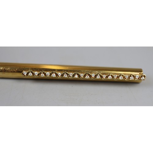 51 - A French classique ballpoint pen, the slender 18ct gold body having decorative clip with 22 claw set... 