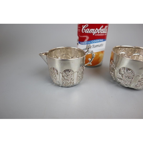 1 - Hallmarked chased silver sugar bowl and cream jug together with silver spoon and 2 sugar nips - Appr... 