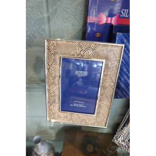 103 - 3 silver plated photo frames in original boxes