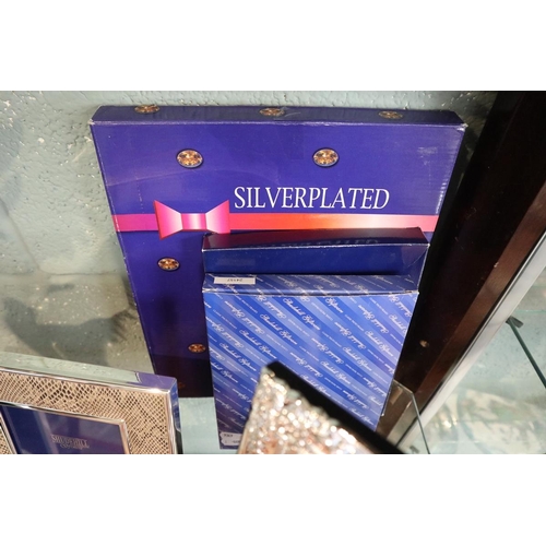 103 - 3 silver plated photo frames in original boxes