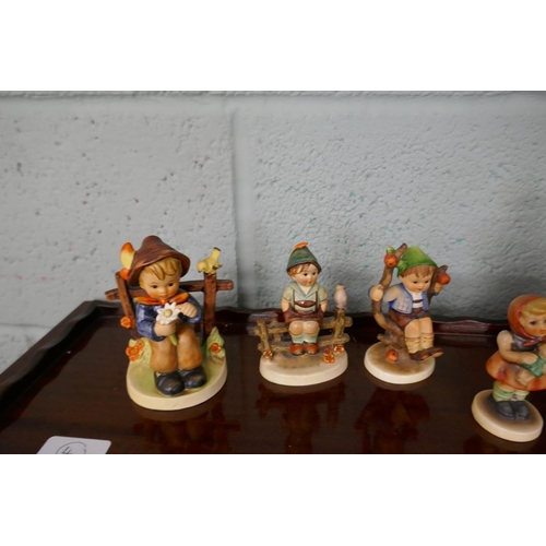 251 - A selection of Goebel figurines with playtime theme after sister Marie Hummel's drawings. All polych... 