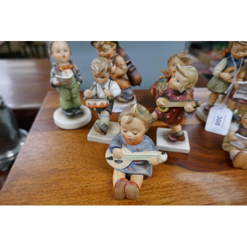 308 - A collection of Goebel figurines with musical theme after sister Marie Hummel's drawings. All are po... 