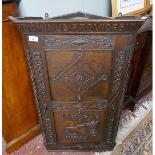 328 - Antique carved oak corner cupboard depicting boar