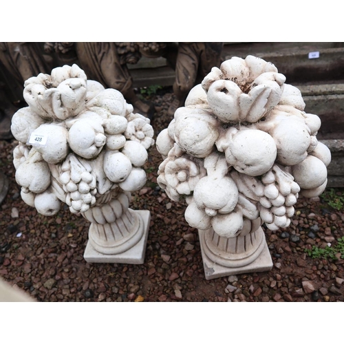 428 - Pair of stone finials depicting fruit