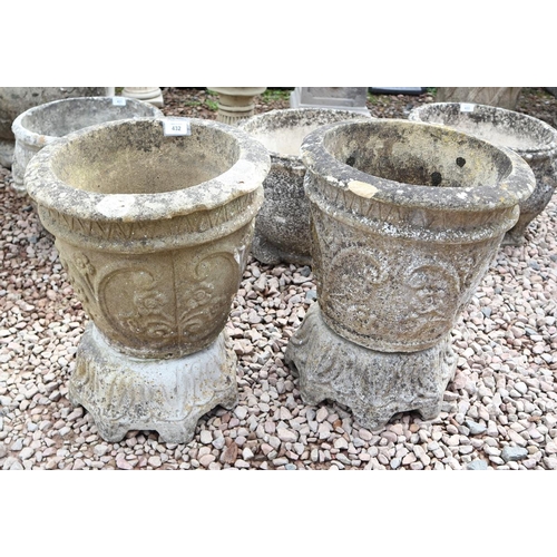 432 - Pair of stone planters on plinths