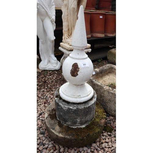 445 - Cast iron finial on stone base