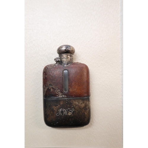 78 - 2 Pistol lighters and a hip flask