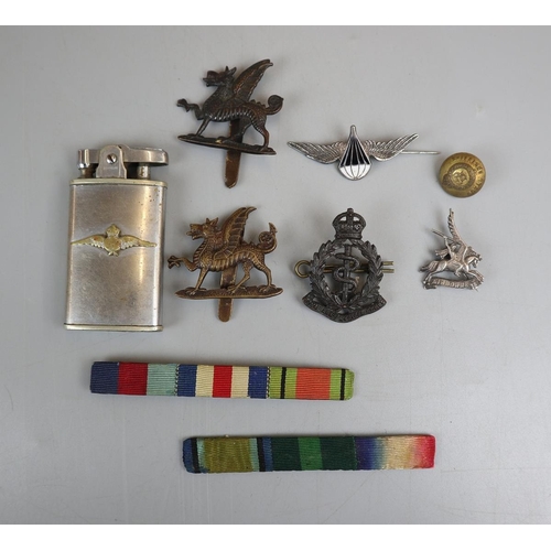 82 - Collection of badges to include silver examples and a Ronson RAF lighter