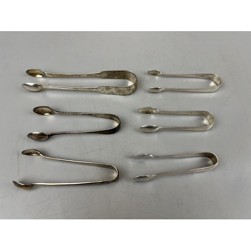 13 - 6 pairs of silver tongs - Approx. weight 138g