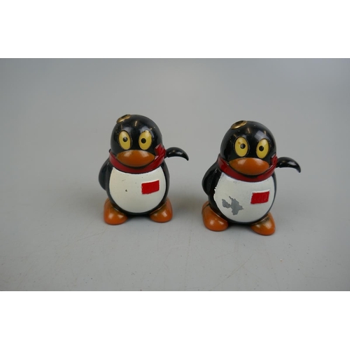 164 - Pair of novelty penguin lighters