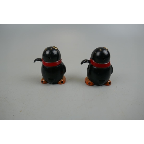 164 - Pair of novelty penguin lighters