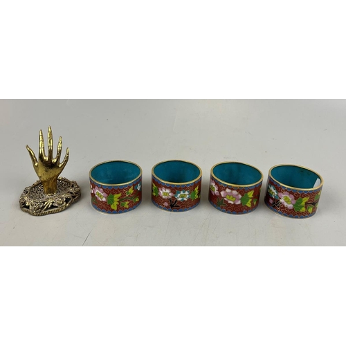 177 - 4 champleve enamel napkin rings together with a brass hand