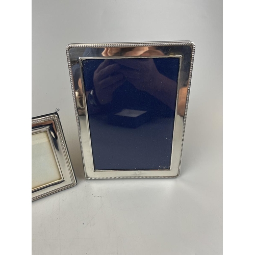 31 - Pair of silver photo frames