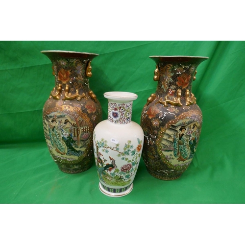 376 - Pair of Oriental vases together with another - Approx. height of pair: 48cm