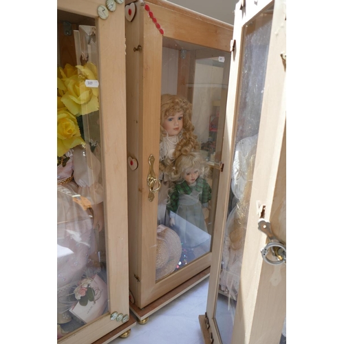 417 - Collection of dolls in display cases etc