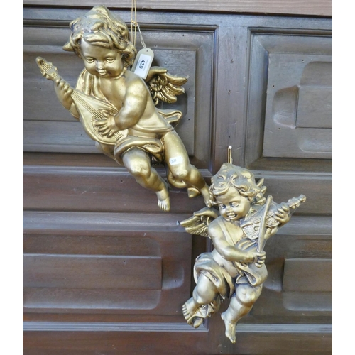 439 - Pair of gilt wall hanging cherubs