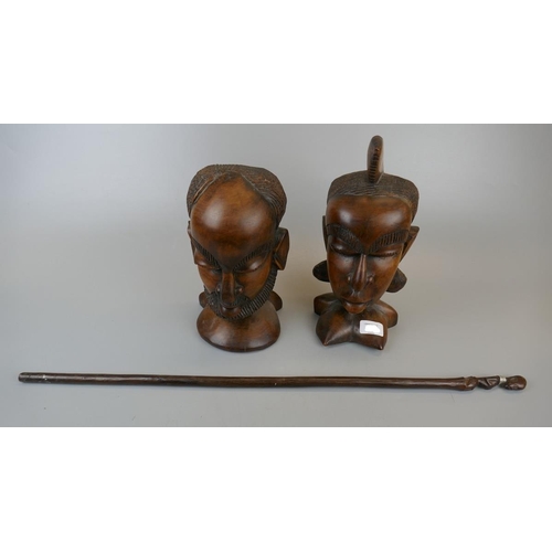 440 - Pair of wooden tribal carvings togther with a carved stick