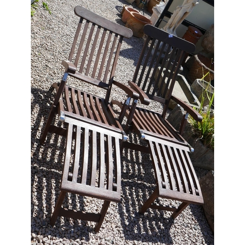 471 - Pair of good quality teak loungers with cushions